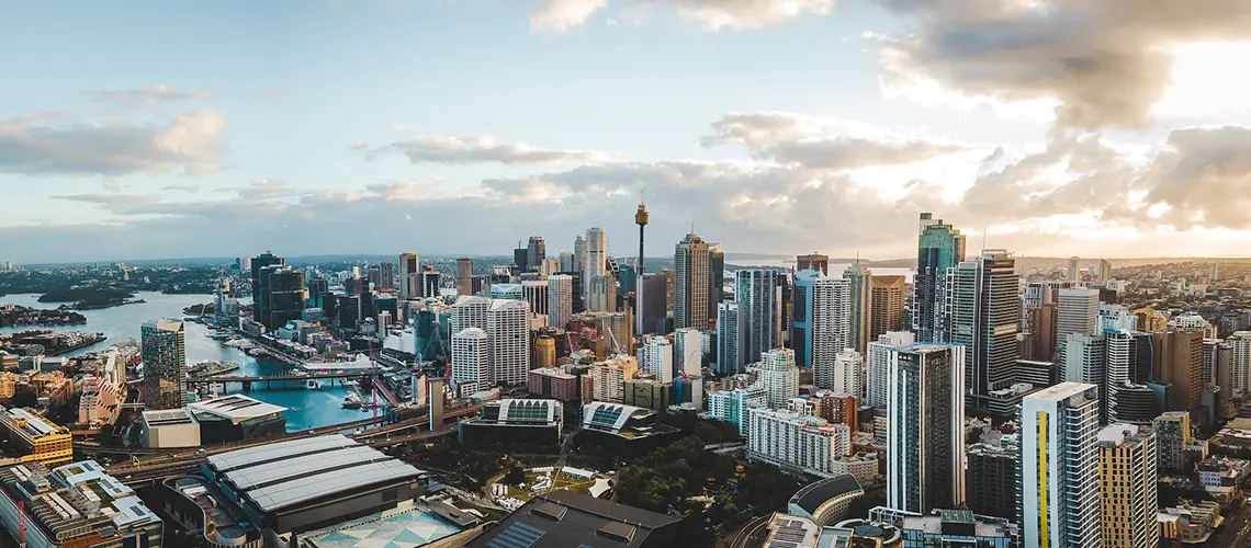 Aerial view of Sydney showcasing contrasting CBD and suburban areas, reflecting differences in commercial property valuation